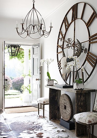 Oversized clock above console table